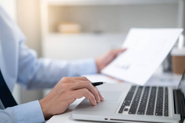 istock Business man working by using laptop computer Hands typing on a keyboard. Professional investor working new start up project. business planning in office. Technology business 1578019524