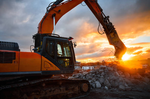 istock Powerful crusher destroys armored cement leftovers at sunset 1578037926