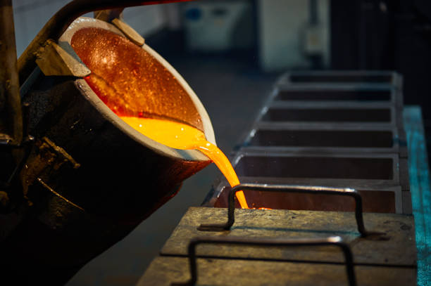 istock Pouring red liquid silver from bucket in induction oven 1578039052
