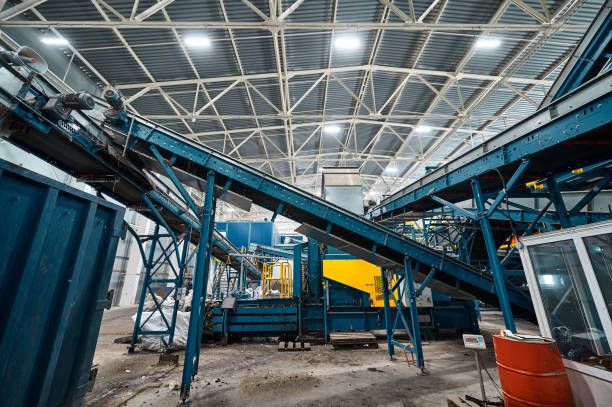 istock Large conveyor lines plant for sorting and processing household waste. 1578039053