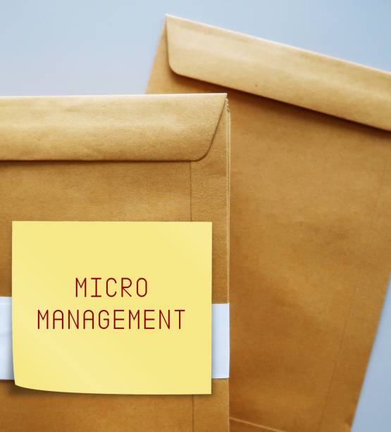 istock Office envelopes with text written note MICROMANAGEMENT refer to management style which boss manager gives excessive supervision to employees, control every part of project 1578060061