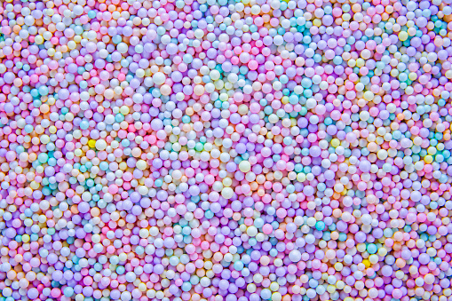 Colorful foam beads texture background. Round multi color foam beads textured.