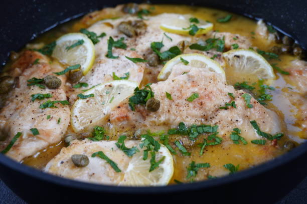 istock Italian lemon chicken piccata with capers and white wine sauce 1578080162