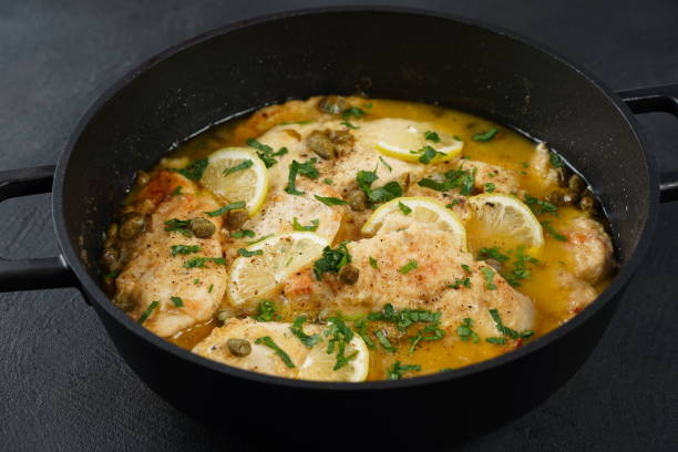 istock Italian lemon chicken piccata with capers and white wine sauce 1578080167