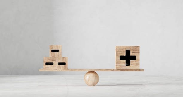 istock One big dice plus and many small dice. On wooden scales on a white background. 1578090337