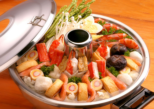 Steamboat on a wooden table.
