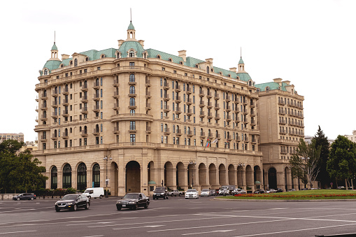 Baku, Azerbaijan - June 28, 2023: A snapshot capturing the grandeur of Four Seasons Hotel bathed in the morning sunlight.