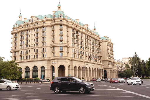 Baku, Azerbaijan - June 28, 2023: A snapshot capturing the grandeur of Four Seasons Hotel bathed in the morning sunlight.