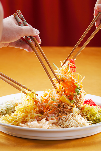 Serving of Yee Sang or Yusheng is believed to bring luck.