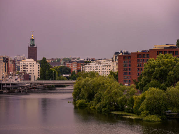 istock View of buildings by river against sky 1578118822
