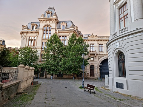 Bucharest with some beautiful buildings in the historic city. The image was captured at dusk during summer season.