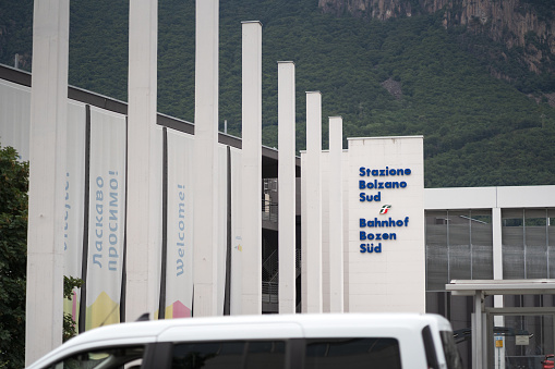 Bolzano, Italy - July 21, 2023: Exterior signage of the Bolzano Sud railway station in German and Italian language