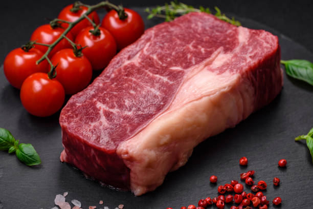 istock Fresh raw beef striploin steak with salt, spices and herbs 1578157006