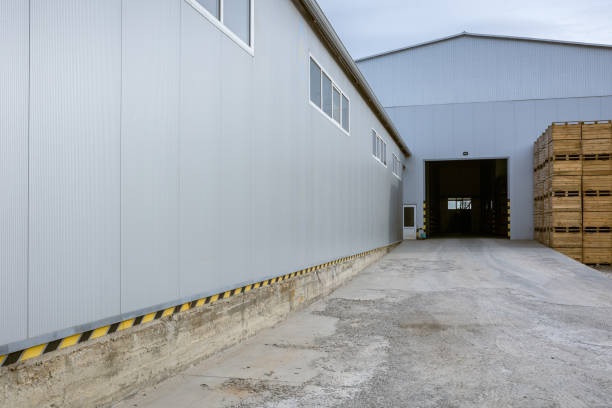istock Cargo terminal of the logistics center. Stacked up empty pallets boxes. Ramp for loading. Supply chain management of finished products in industrial production 1578192617