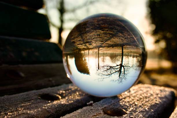 istock Crystal ball on wooden bench during winter 1578193229