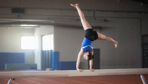 istock Female Gymnast On Balance Beam 1578197089