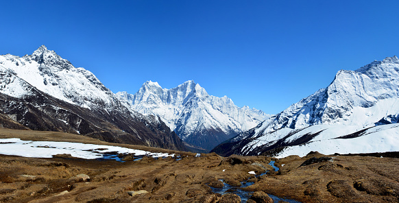 View of the magnificent Himalayan mountains on the background of blue sky, Sagarmatha national park, Nepal.