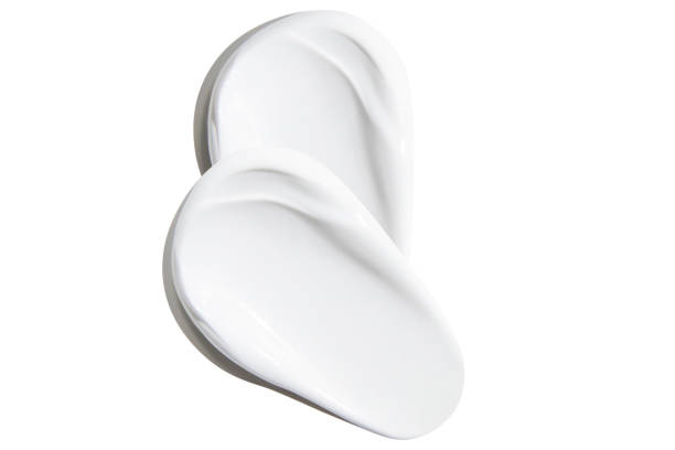 istock Smears of beautiful white cream on an empty background. isolated 1578248092