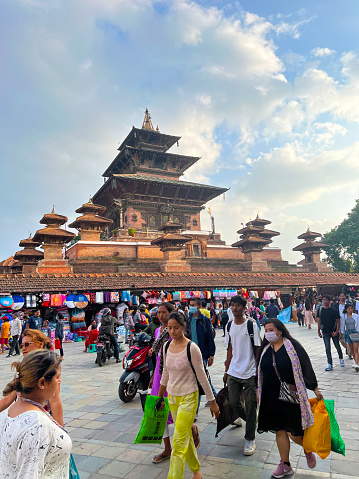 People are walking street scene in Kathmandu the capital of Nepal vertical travel still
