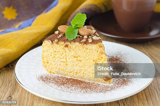 Piece Of Pumpkin Cheesecake Closeup Stock Photo - Download Image Now - Almond, Baked, Baked Pastry Item