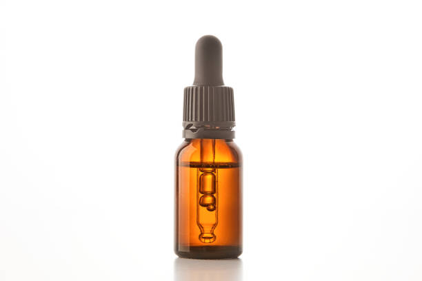 istock Brown glass container with pipette for cosmetic product. 1578336238