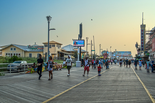 Atlantic City NJ, USA - July 18, 2023: A crowded boardwalk on a Summer day in Atlantic City, New Jersey.