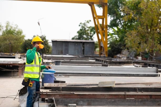 istock Take a break from hard work. Tired hot wiping sweat. Construction worker man people drinking water from cold flask 1578438515