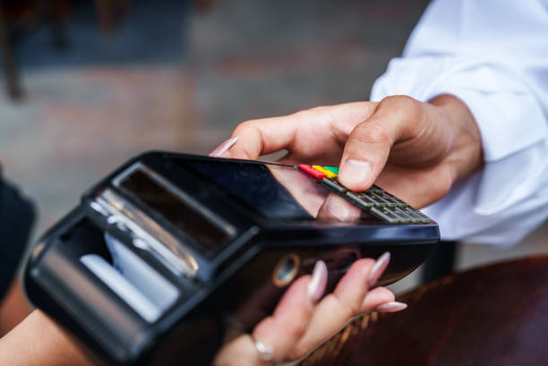 Paying the bill and entering the pin code at the bar stock photo