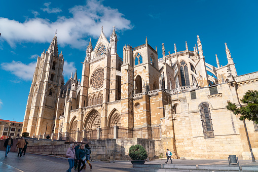 Burgos, Spain - August 1, 2021: The Cathedral of Saint Mary of Burgos, Spain with tourists waiting in line to visit.