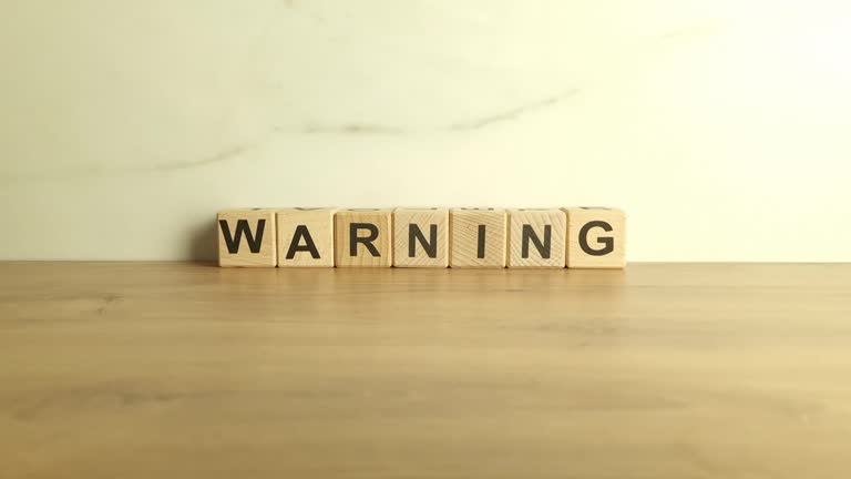 Word warning from wooden blocks