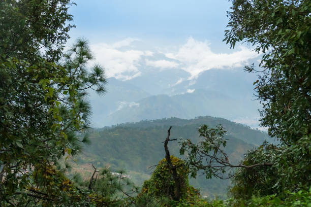 istock White clouds over distant Himalayan mountains, monsoon landscape of Himalays,Garhwal, Uttarakhand, India. Climate change effect on Himalays bringing landslide,untimely rain,destruction of environment. 1578540859