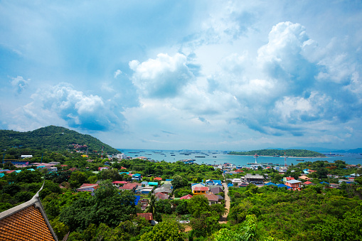 Land scape panorama with tropical clouds of Ko Sichang island and town. Ko Sichang is small island close to coast of Chonburi province