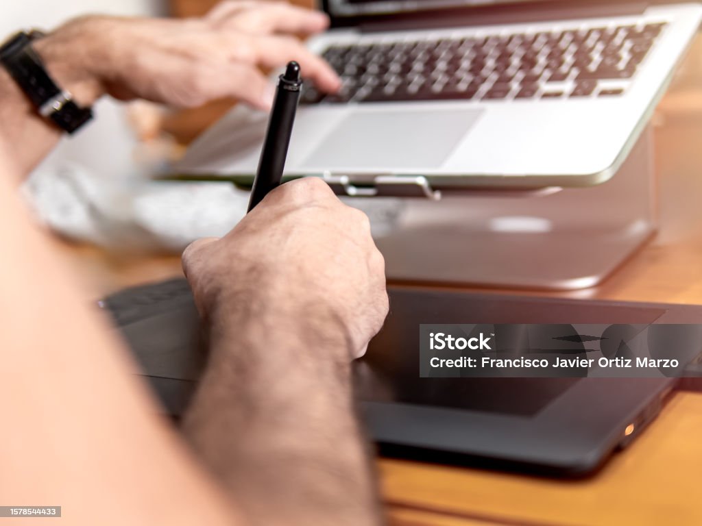 Man Operating Computer And Drawing With Digital Pen On Graphics Tablet ...