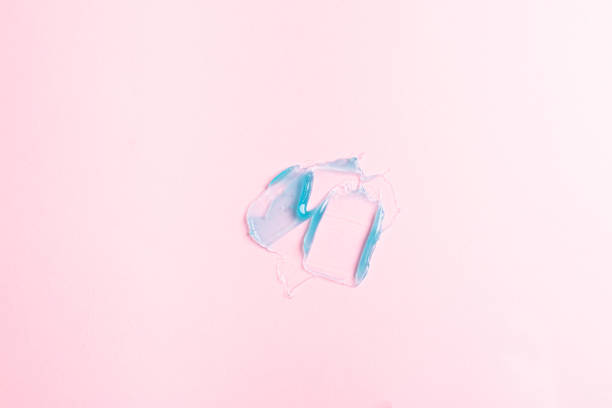 istock Liquid gel cosmetic product on pink background 1578546340