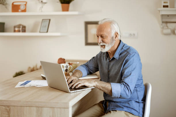 istock Senior Man at Home Office 1578548060