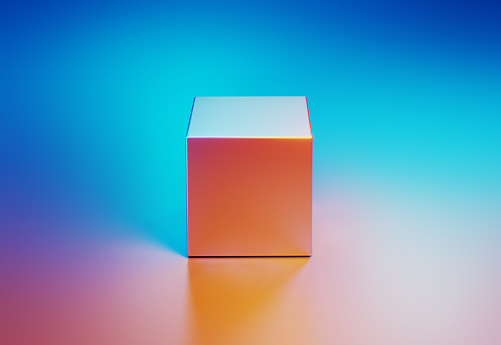 Metallic cube object illuminated by blue and pink lights on blue and pink background. Horizontal composition with copy space.
