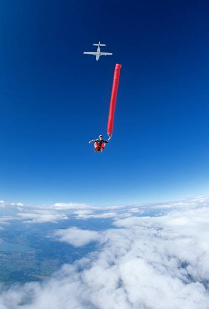 istock Skydiver in free fall with colourful streamers 1578548237