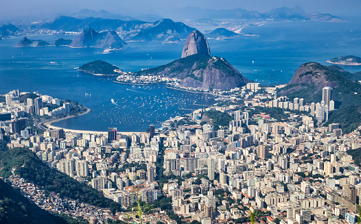 Panoramic aerial view of cityscape Rio de Janeiro, beachfront district. Panorama of Rio city, Brazil, landscape at Atlantic ocean background. Urban wallpaper concept. Copy ad text space poster