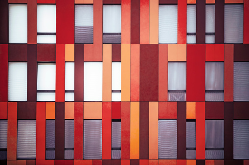 Geometric shapes formed by windows of a building exterior. Horizontal composition with copy space.