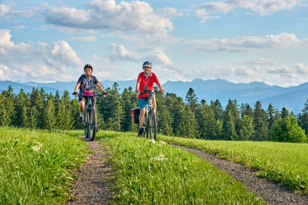 istock two senior women ciycling with e bikes in the German Alps 1578560607