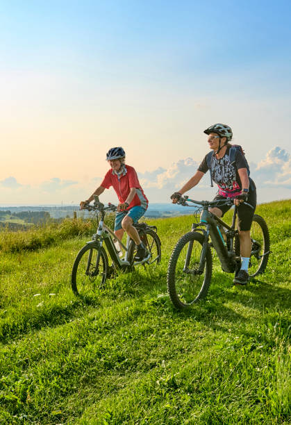 istock two senior women ciycling with e bikes in the German Alps 1578560976