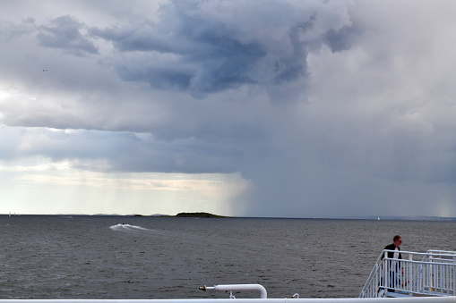 Bad weather threatening at sea. The horizon seen from a ferry.