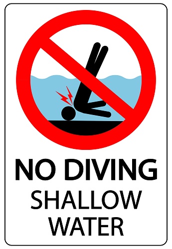 No diving, shallow water. Ban sign with pictogram of person banging his head on the seabed. Text below.