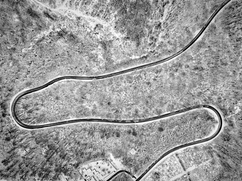 Winter winding road photographed from above. Drone photo.