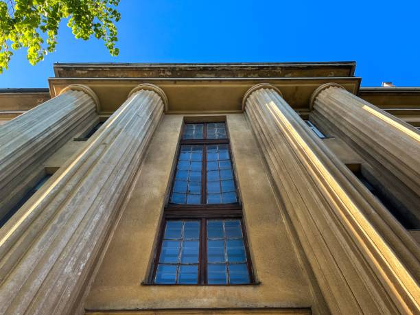 istock Building in Kaunas, Lithuania boasting intricate architecture and columns against a vibrant blue sky 1578673600
