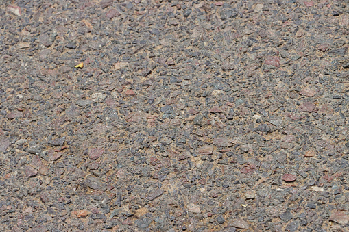 Stock photo showing close-up, elevated view of a decorative driveway surface finish of exposed aggregate.