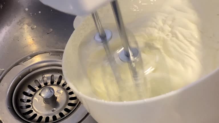 Whipping cream next to the kitchen sink