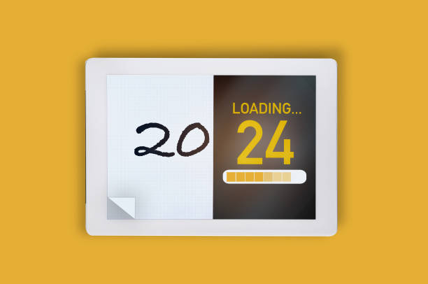 istock 2024 traditional on white paper and artificial intelligence digital tablet technology on yellow background 1578711702