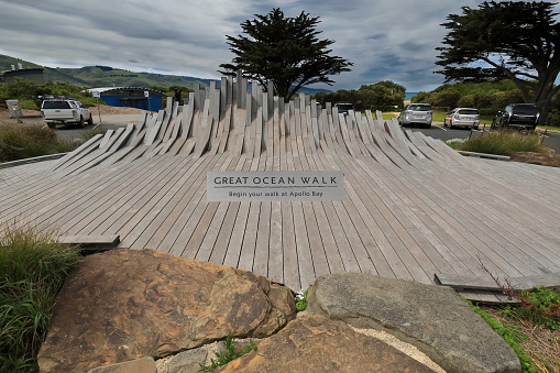 Wooden plank marker at the beginning in Apollo Bay of the one way, east-west direction Great Ocean Walk stretching for 110 km until Glenample Homestead near the Twelve Apostles. Victoria-Australia.
