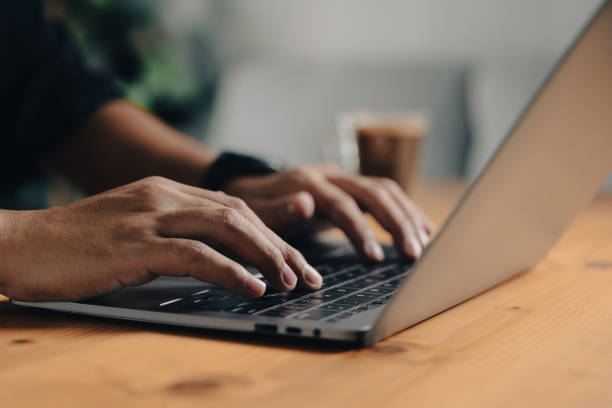 istock Man with laptop for multitasking and connecting wifi to internet 1578779436